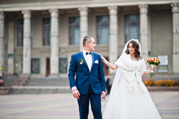 istock Wedding couple walk to the central square backgound theater with columns 674602374