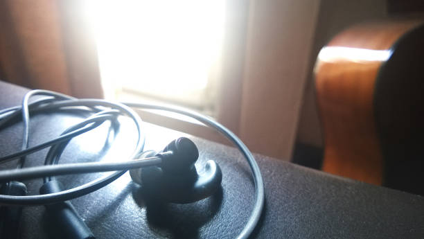 istock earphones on  leather brown sofa 674602668