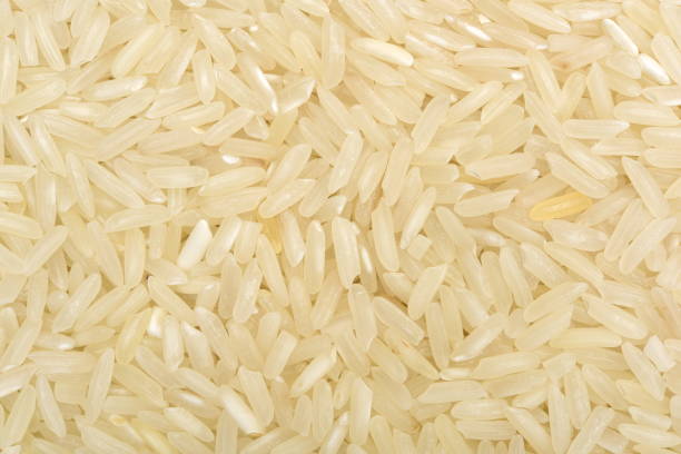 istock Heap of raw Jasmine rice  background. 674603194
