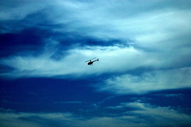 istock Clouds and helicopters in the Spanish sky 674609592