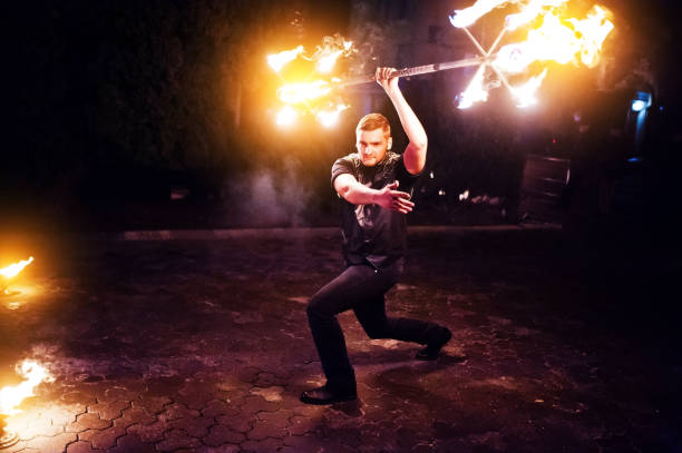 istock Presentable and awesome fire show at evening on wedding party.Photo with some noice 674609964