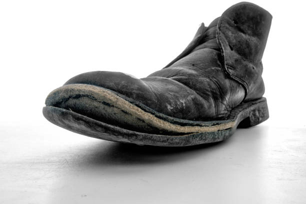 Man's old work boot. Wide angle view for effect.