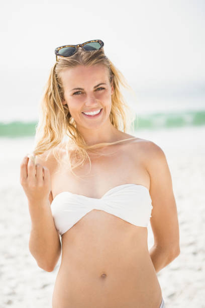 istock Blonde woman posing on the beach 674619874