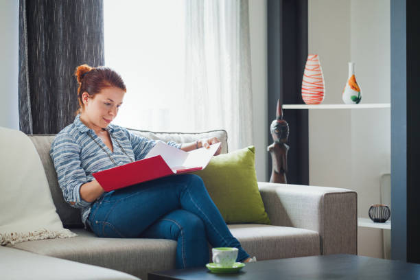 istock Young woman working at home 674624396