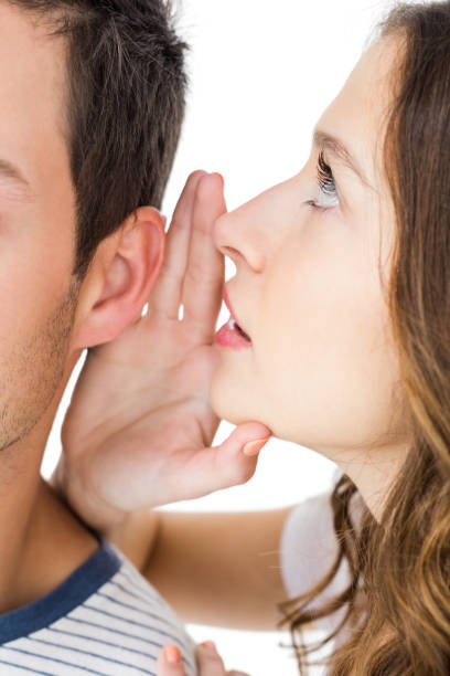 istock Young couple sharing a secret 674624554