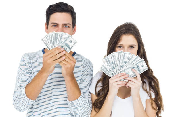 istock Happy couple holding money 674625874