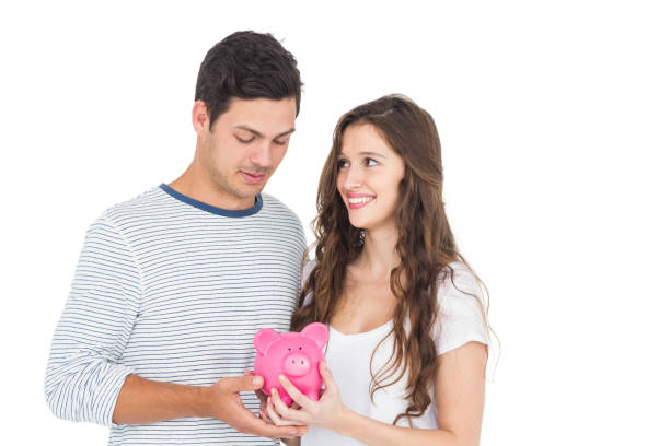 istock Couple holding piggy bank 674626848
