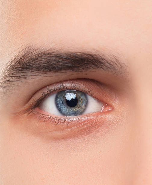 istock Beautiful blue man eyes close up 674627250