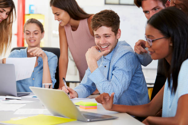 istock Colleagues working together in a busy office, close up 674627750