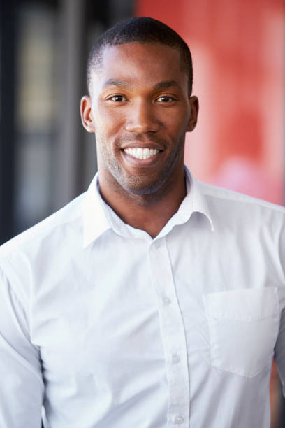 istock Vertical portrait of young black man smiling 674627848