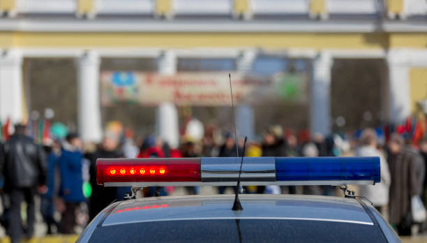 istock Police car on duty during festival 674630916