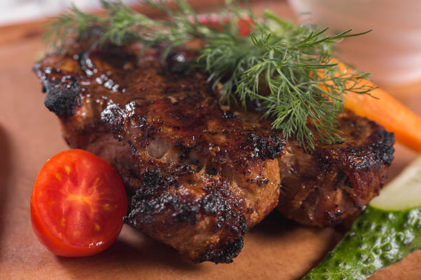 istock Grilled meat decorated with fresh vegetables 674631512