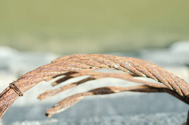 istock Close up of rusty steel cable. Iron rope. 674635392