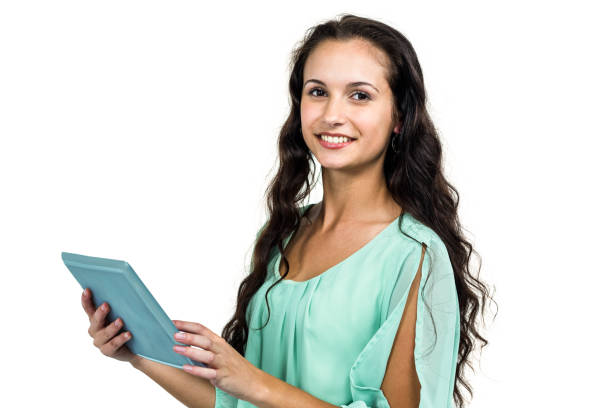 istock Smiling woman holding tablet and looking at camera 674639730