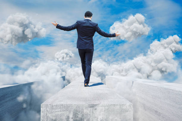 istock Businessman walking on the edge 674643892