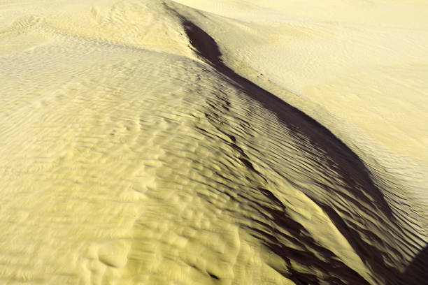 Khaki color. Natural texture and background of the desert. Sand patterns