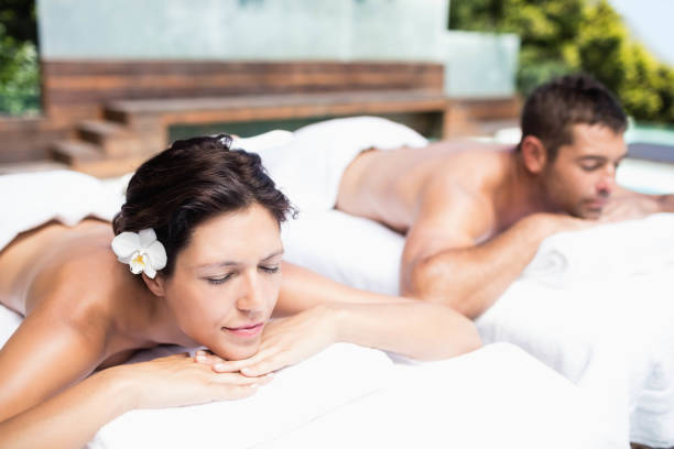 istock Young couple relaxing on massage table 674648838
