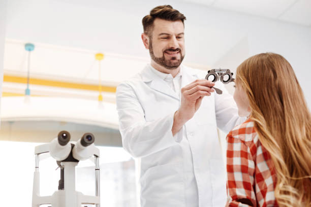istock Qualified professional optician trying on special glasses 674650272