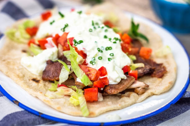 istock Gyros with vegetable, meat and tzatziki sauce 674653580