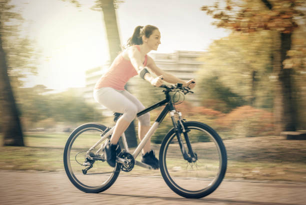 istock Carefree woman riding bicycle 674663112