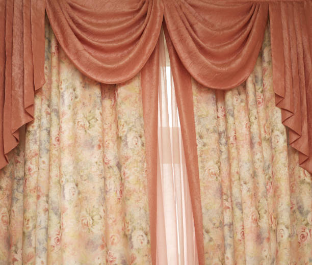 istock Two pink portieres at a window 674667644