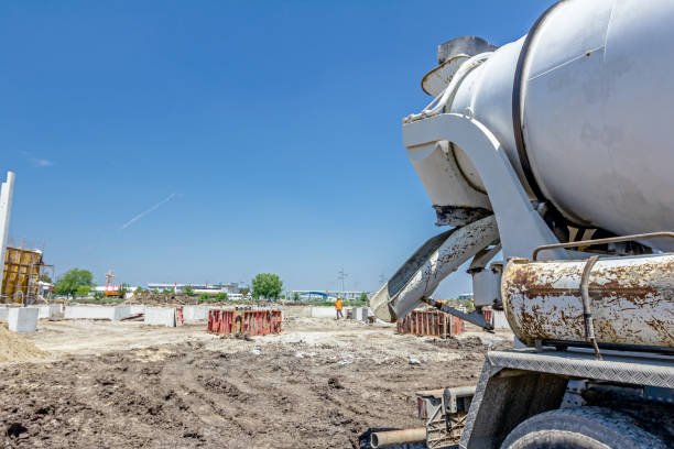 istock Back side view on concrete mixer, ready for pouring into transporter 674667740