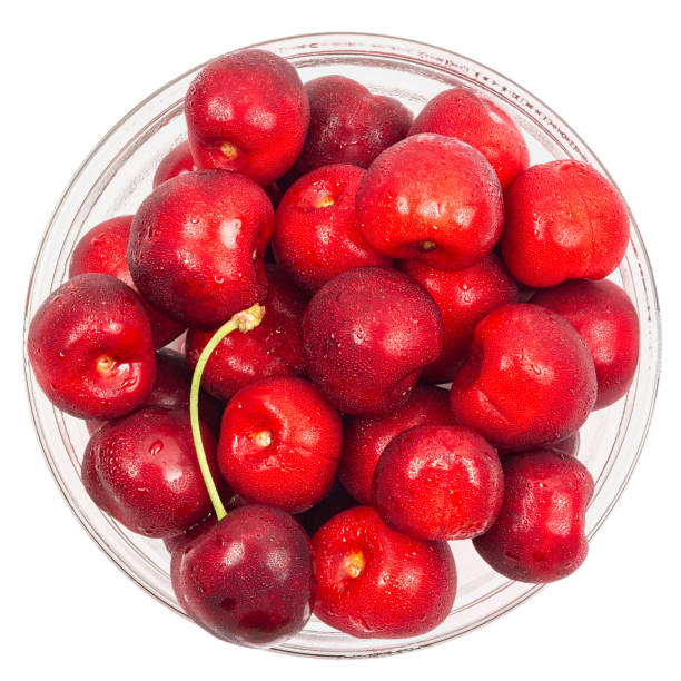istock Cherry barries  in a glass bowl isolated on white background 674667766
