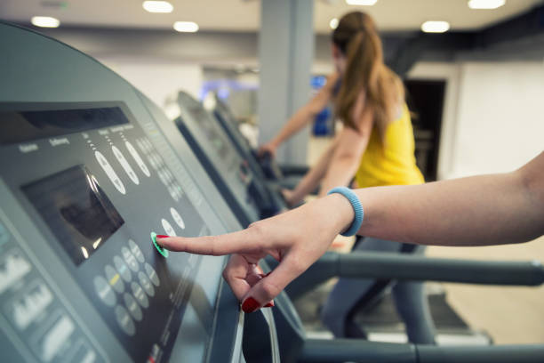 istock Woman adjusting speed on running track. 674673818