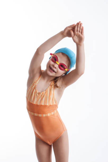 istock Little girl in a orange swimsuit 674675162
