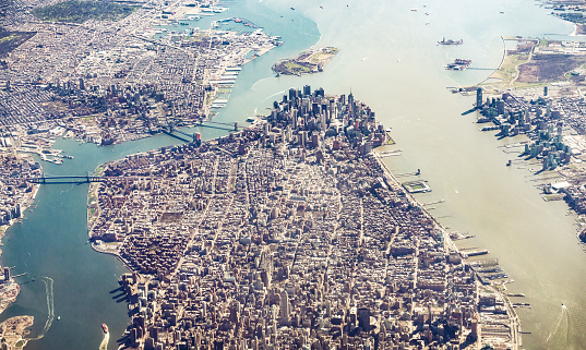An aerial view of Manhattan Island and across to Brooklyn, with the skyscrapers of Lower Manhattan in the centre of the image.