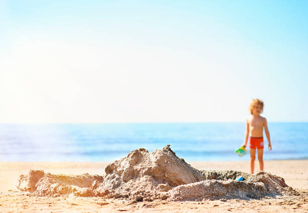 Sand castles on a beach on summer sunset