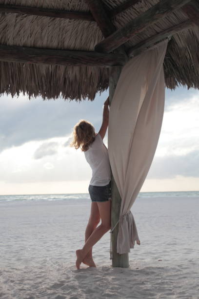 istock Woman on a beach. 674694072