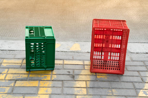 istock used red and green plastic box beside the road 674694930