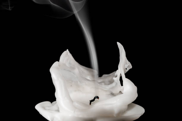 istock Closeup of white blown out and smoking candle 674701612