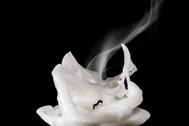 istock Closeup of white blown out and smoking candle 674701836