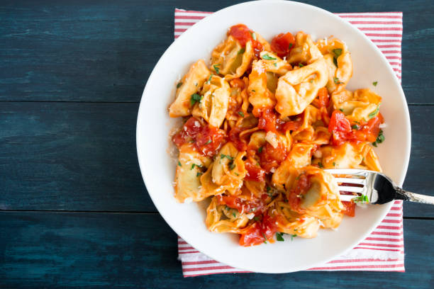 istock Homemade tortellini with tomato sauce 674717124