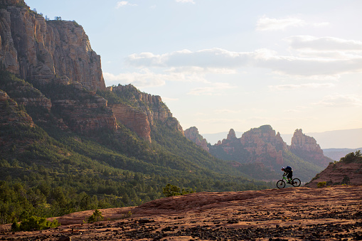 A man rides his mountain bike on a popular trail in Sedona, Arizona, USA.