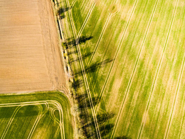 istock drone image. aerial view of rural area with freshly cultivated fields 674718166