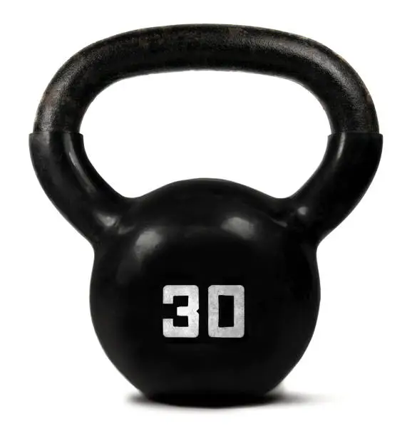 Old kettlebell weight on a white background.
