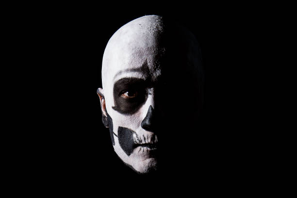 istock Beautiful man with creative make-up for the Halloween party 674720990