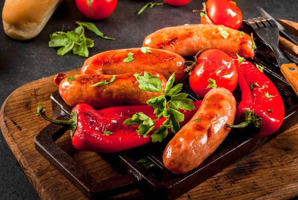 istock Grilled sausages and vegetables 674723912