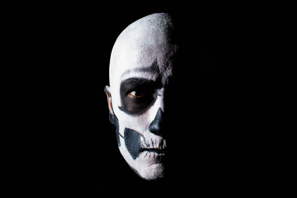 istock Beautiful man with creative make-up for the Halloween party 674725068