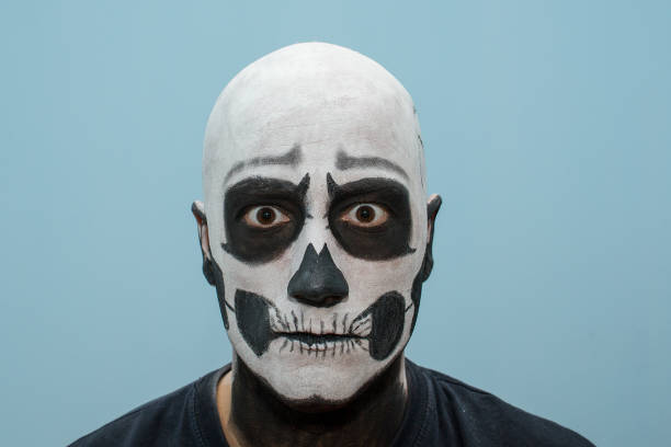 istock Beautiful man with creative make-up for the Halloween party 674726012
