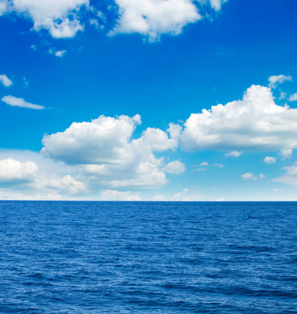 istock white fluffy clouds with rainbow in the blue sky 674731210