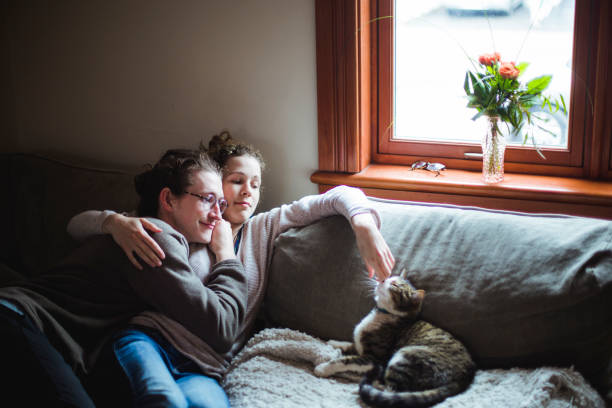 istock A young couple  and a cat together on a sofa 674743522