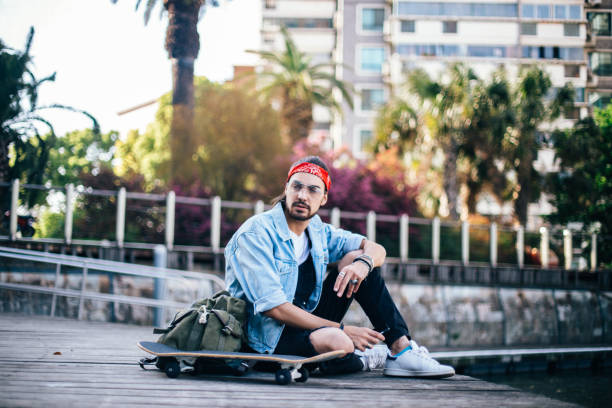 istock Skater guy in park relaxing 674744300