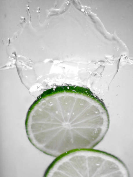 istock Hey fresh and cool lime fruites jumping in cold water. 674744458
