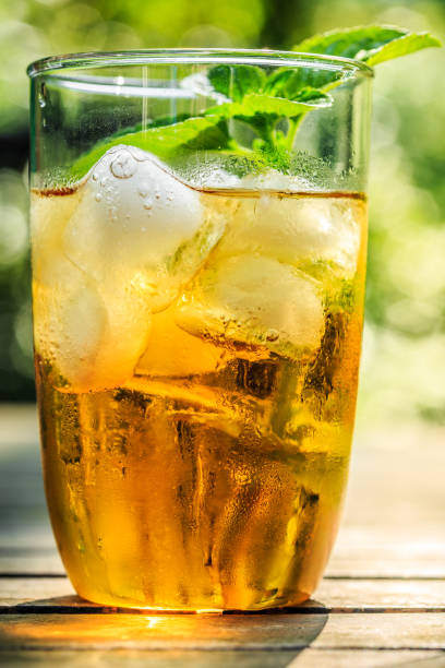 istock Glass of iced tea with ice-cubes 674747534