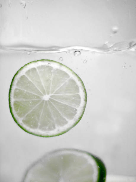 istock Hey fresh and cool lime fruites jumping in cold water. 674749680