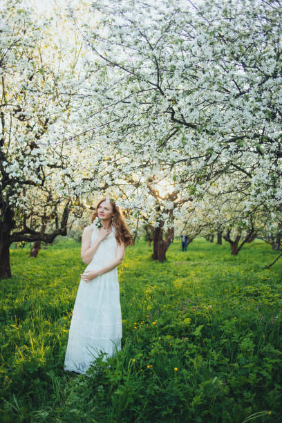 istock A girl in an apple orchard 674749752